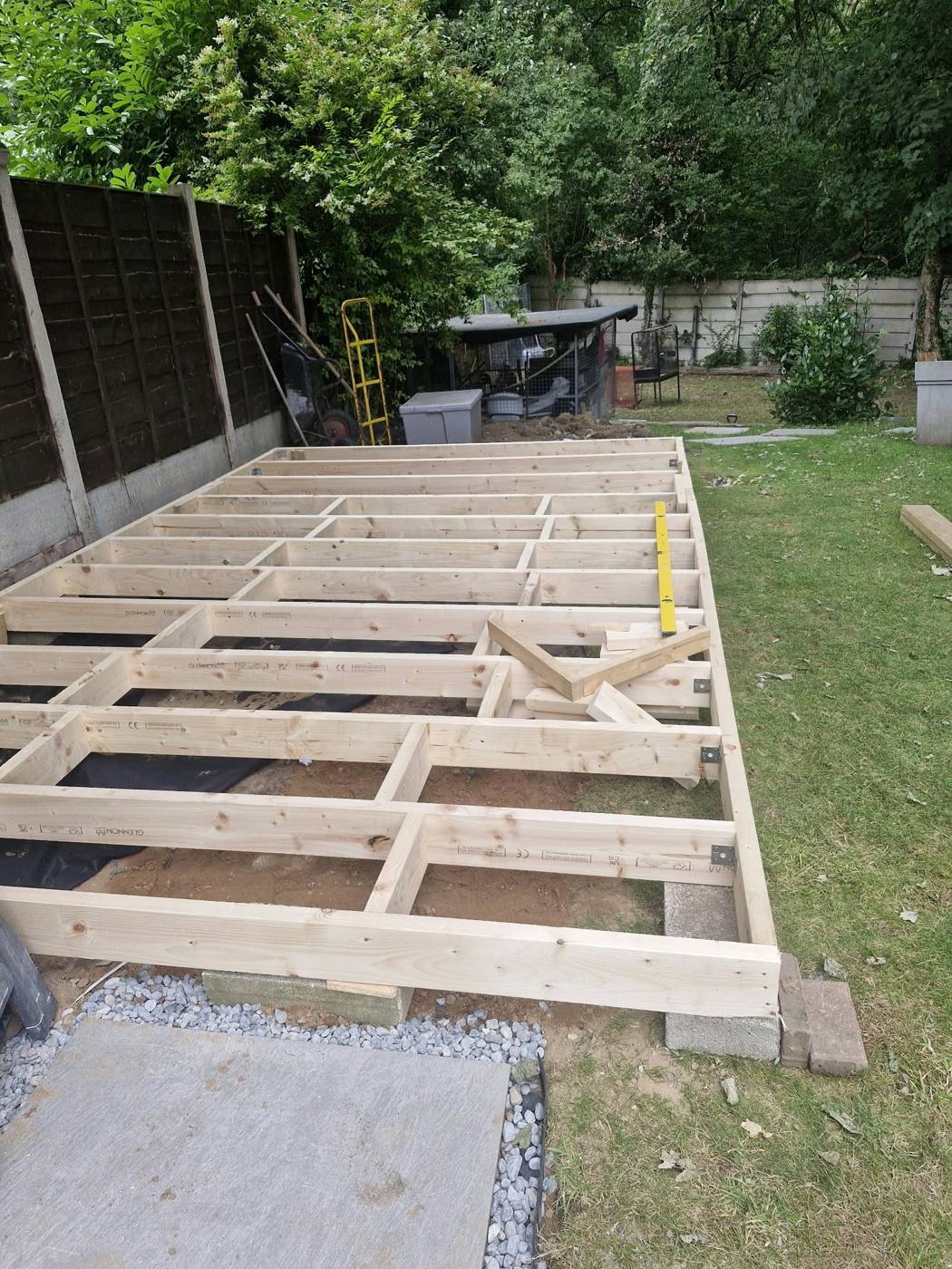 Treated timber deck frame set on blocks over weed membrane